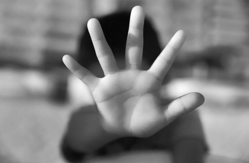 Child doing stop gesture