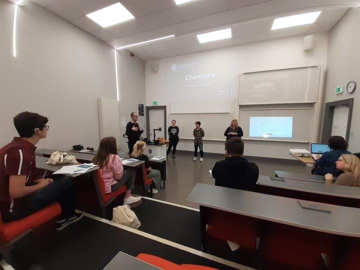 A group of deaf students in a lecture theatre