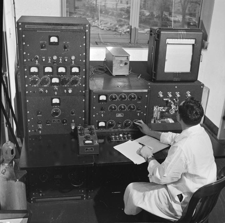 Scientist working with an early computer