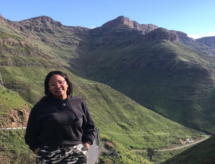 Tlalane Cecilia Matsoso, fourth year law student, pictured against the backdrop of mountains in her home country of Lesotho