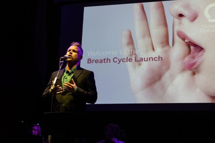 A singer on stage at the launch of Breath Cycle II
