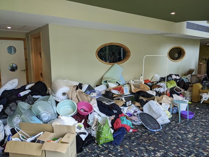 Discarded belongings in a hallway.