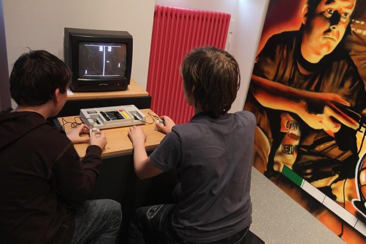 Visitors try out Pong at the Computer Game Museum in Berlin, Germany 2011