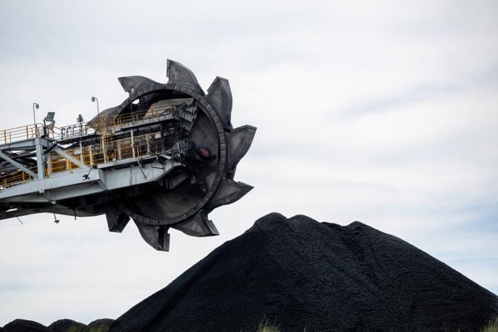 Image of large coal pile and loader