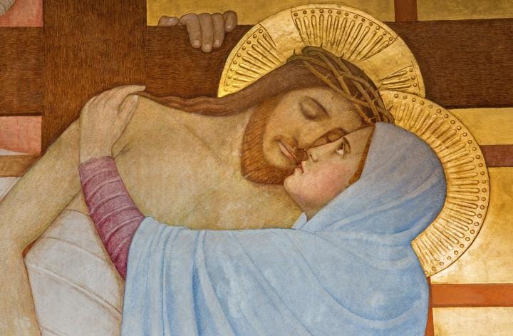A woman takes Jesus down from the cross