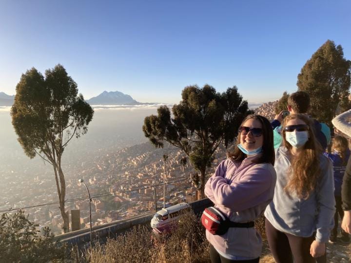 Students look down on the vast city of La Paz