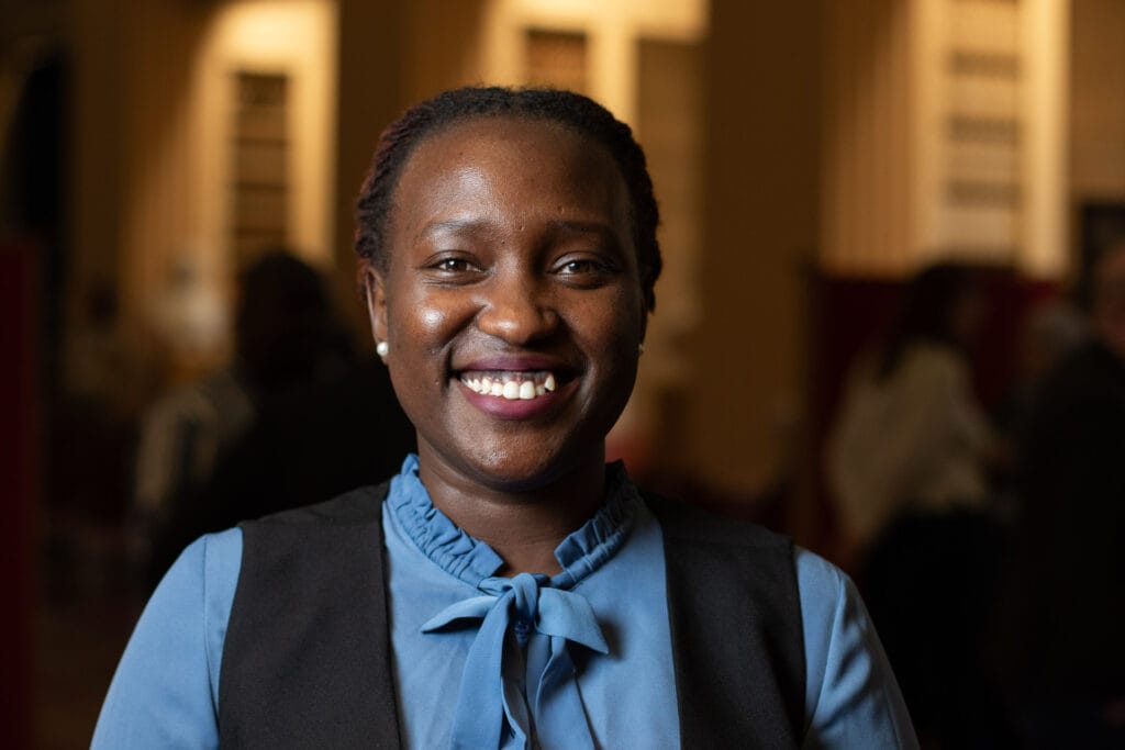 Foni Joyce Vuni a smiles at the camera.