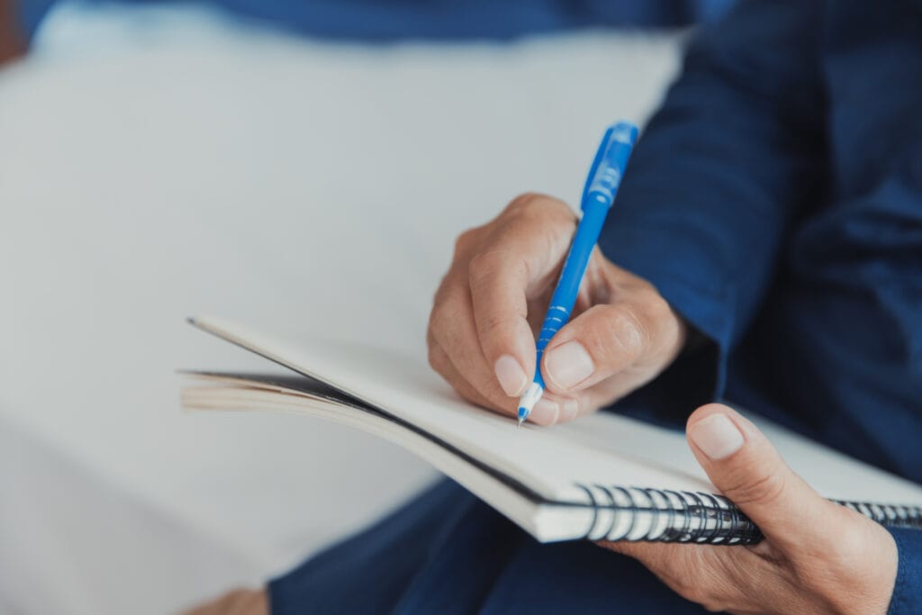 Person beginning to solve a problem on a notebook.