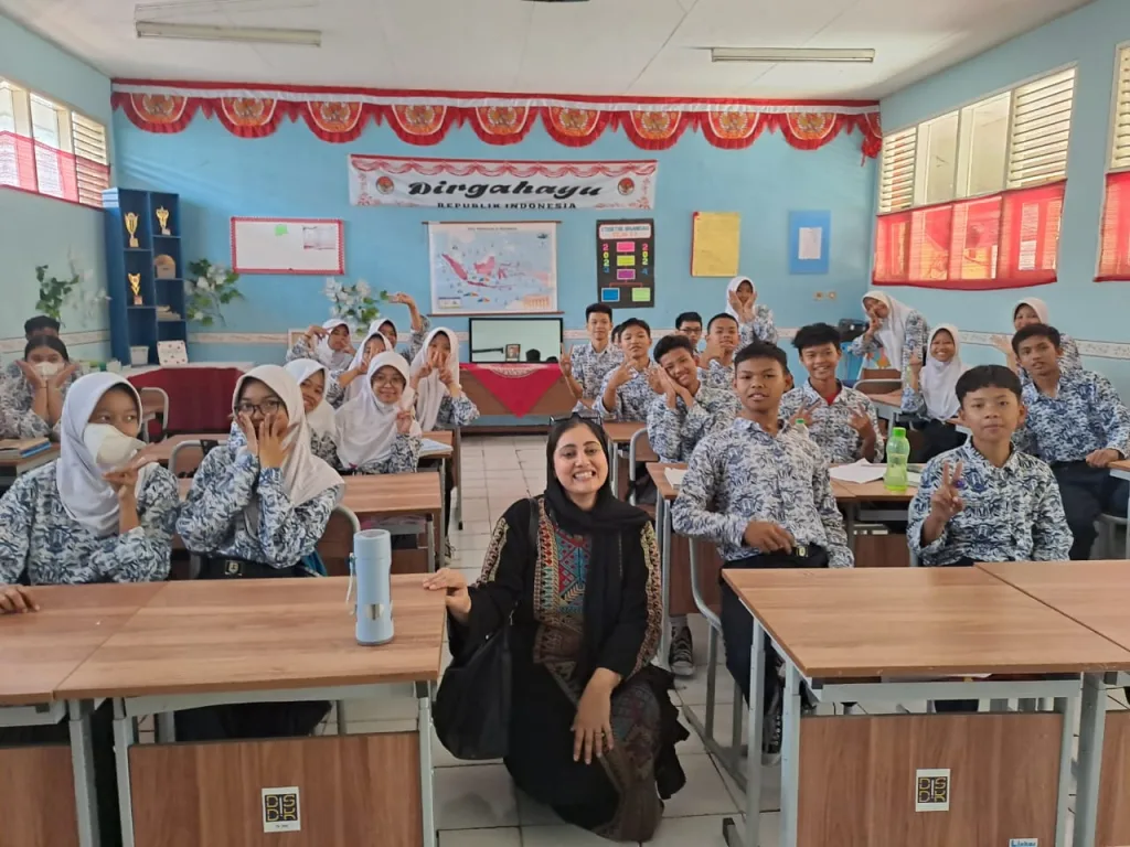 A Pakistani woman in a classroom with school pupils in Indonesia 