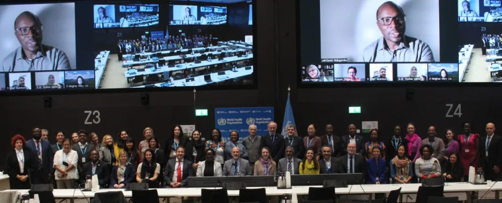 A crowd of delegates on stage at a conference about maternal health in Geneva