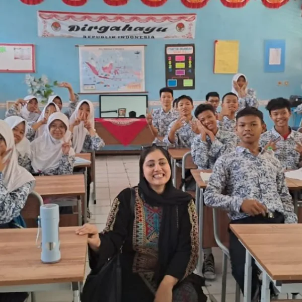 A Pakistani woman in a classroom with school pupils in Indonesia