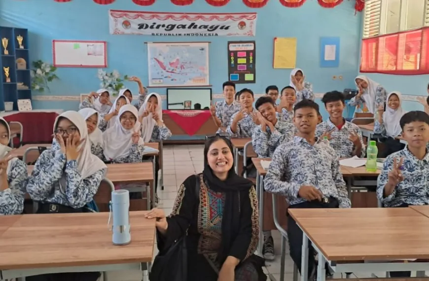 A Pakistani woman in a classroom with school pupils in Indonesia