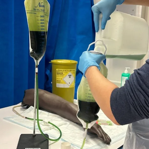 A man handling green blood