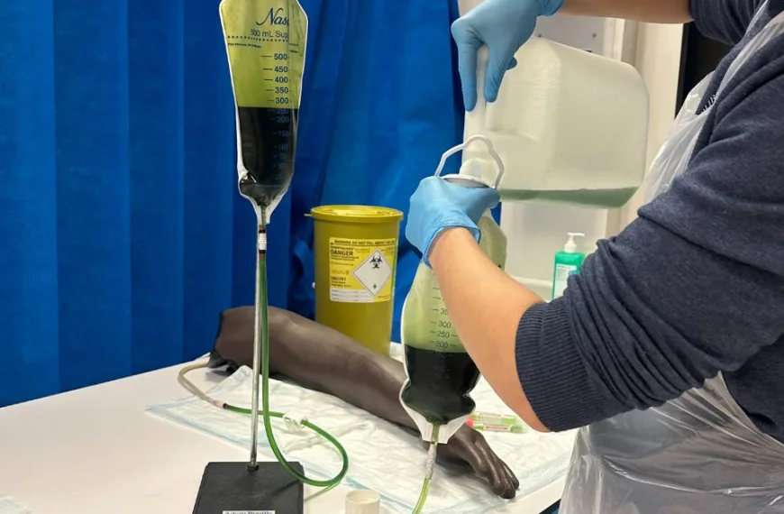 A man handling green blood