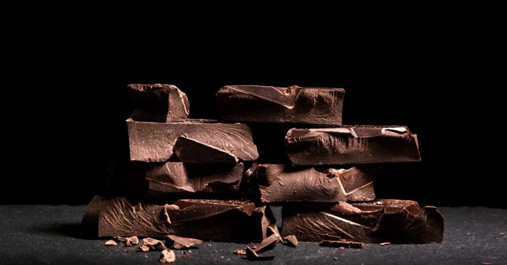 Squares of chocolate piled on top of each other 