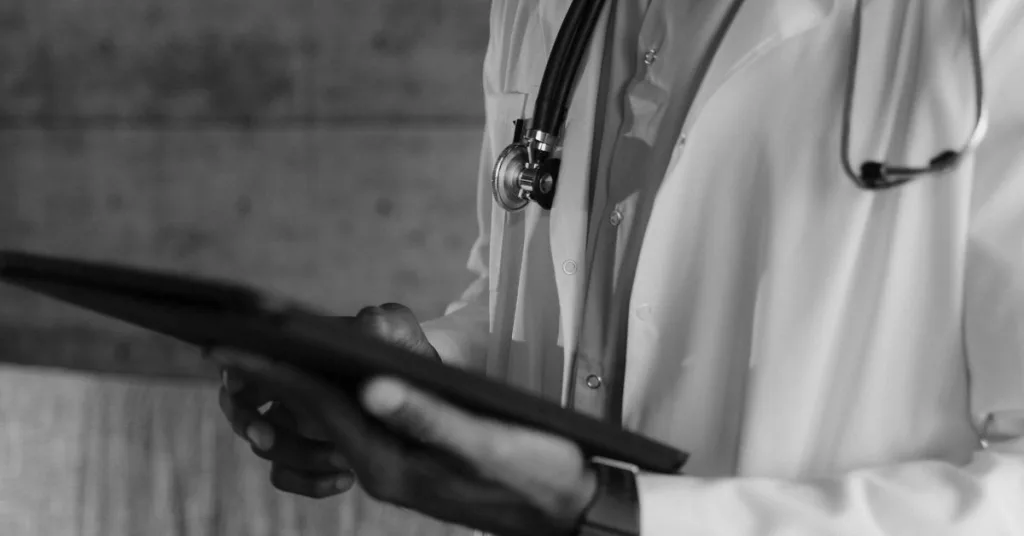 A doctor in a white coat with a stethoscope 