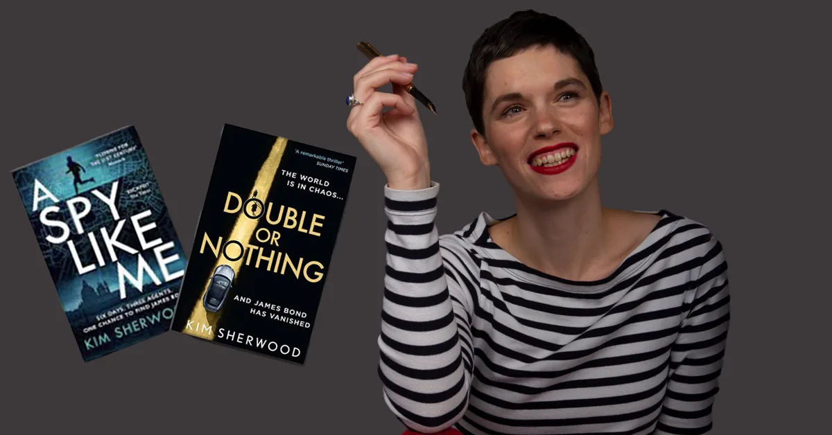 Kim Sherwood posing with two of her books: A Spy Like Me and Double or Nothing.