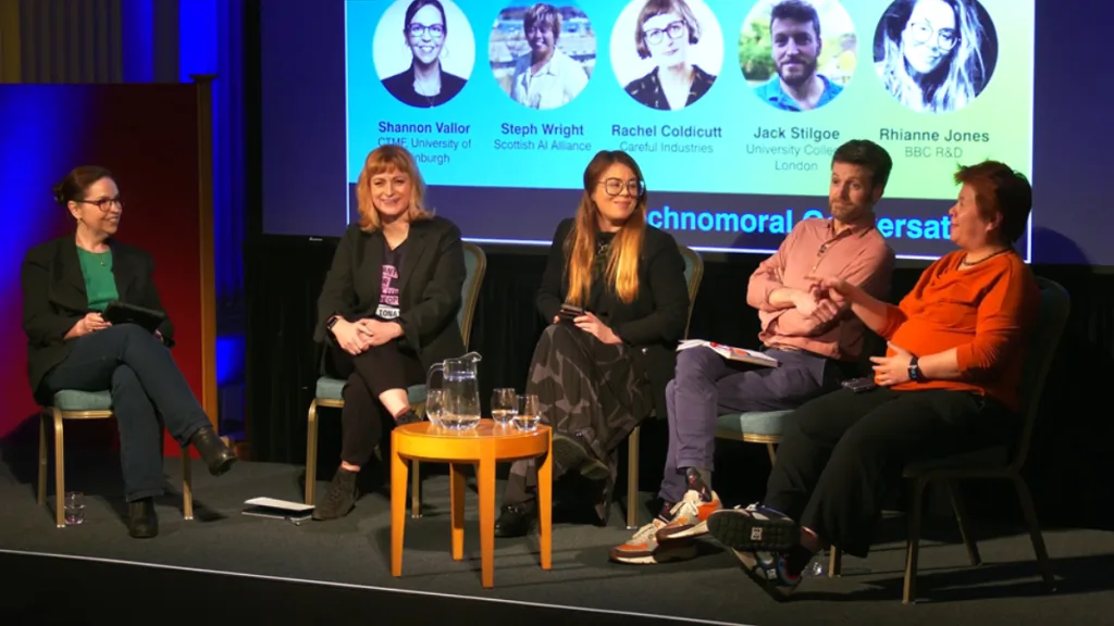 A panel of five people discussing the ethical implications of emerging technologies.