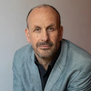 Headshot of Professor Michael Eddleston, wearing suit