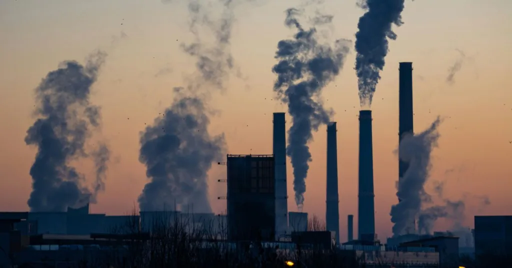 Smoke emitting from buildings during sunset