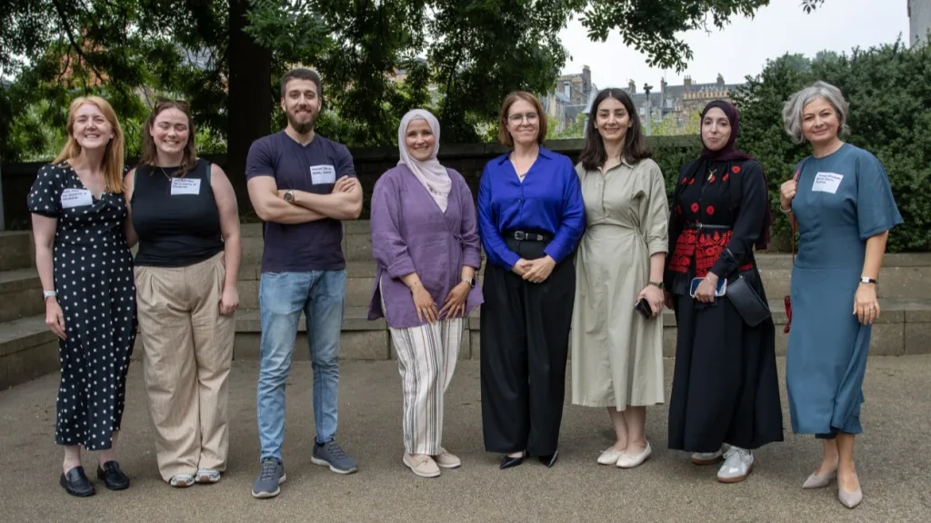 A group of University staff, partners and scholars pictured outside during the annual HESPAL gathering, including Murhaf Abdelhadi (third from left), a HESPAL postgraduate scholar studying at Edinburgh.