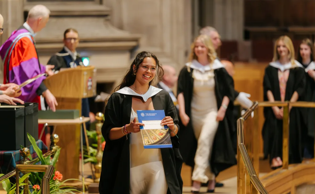 Graduates walk across the stage at McEwan Hall during the summer 2026 graduations (image credit Mihaela Bodlovic)
