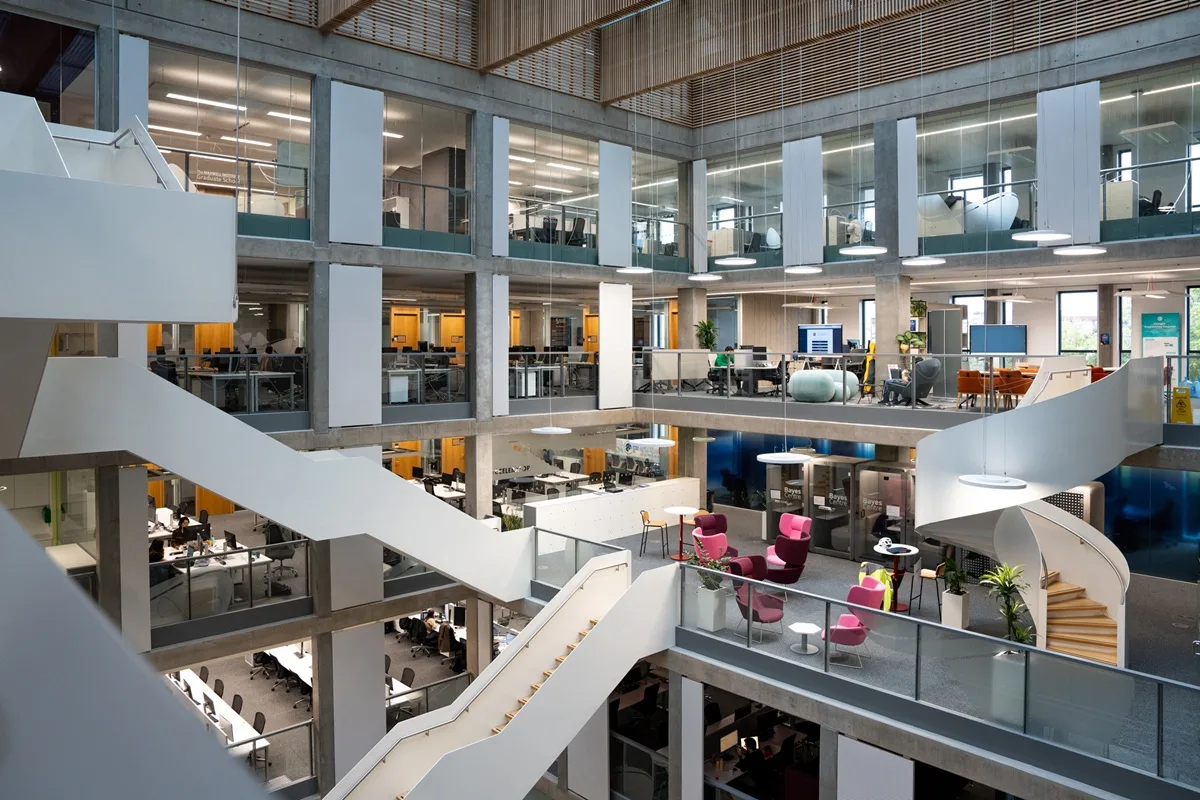 Internal picture of the Bayes Centre showing the interlocking white staircases