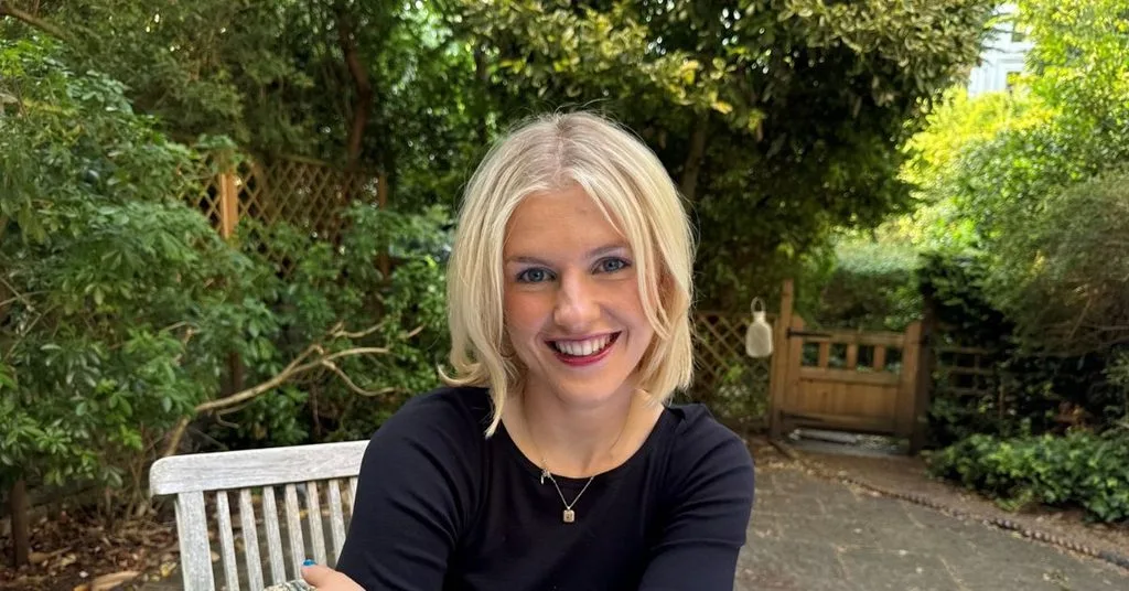 A person sitting on a bench smiling