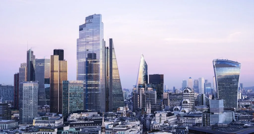 View over London's financial district skyline at sunset.